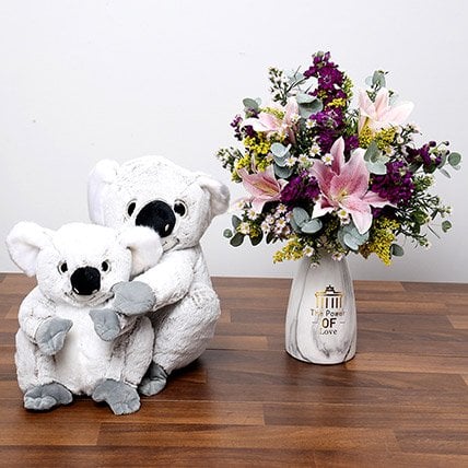 Buy Pink Purple Flowers In Vase With Teddy Bears Price